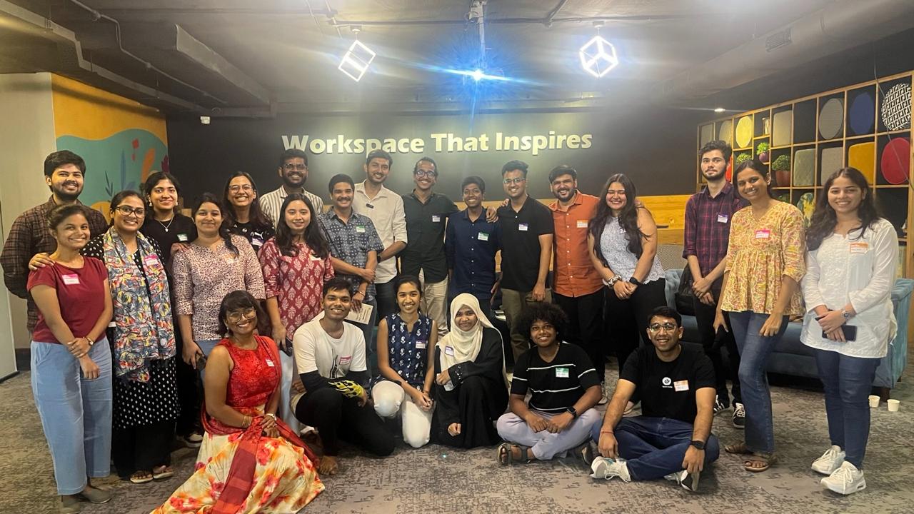 Large group photo of students at a design studio meetup